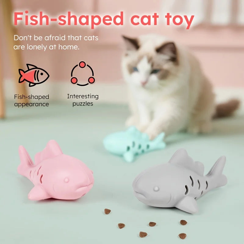Interactive treat dispenser toy in fish shape for cats with puzzle features to keep them engaged and entertained.