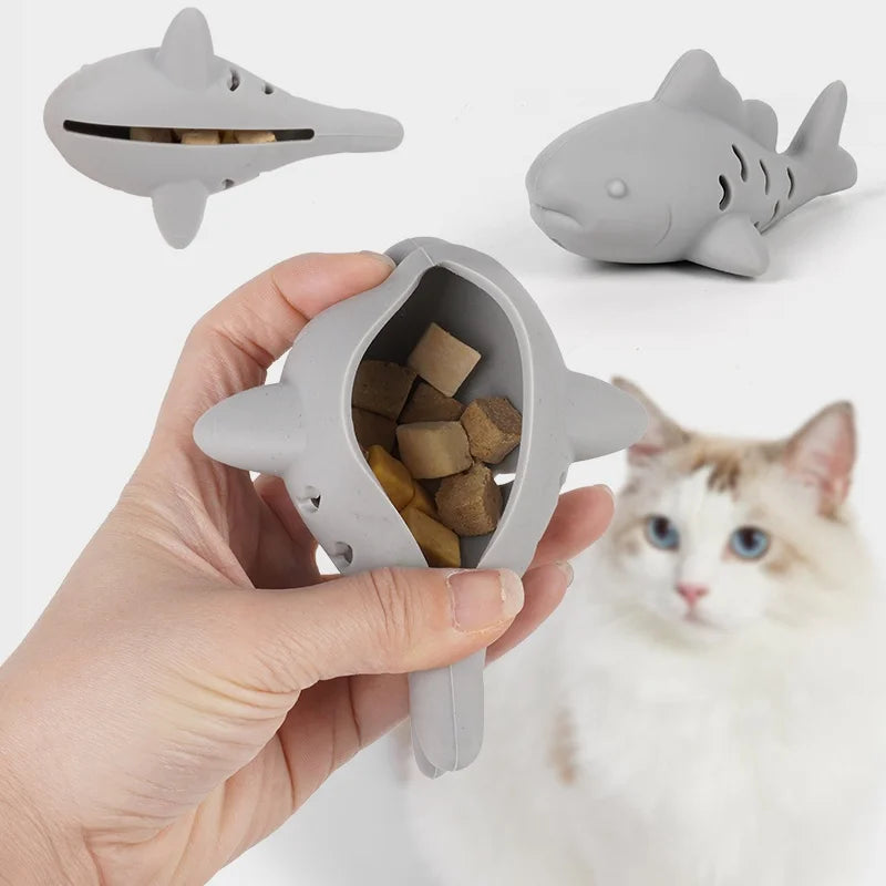 Interactive treat dispenser toy in hand with treats inside, designed for pets to enjoy and stay engaged.