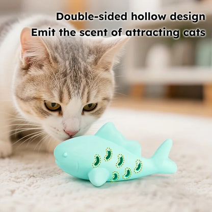 Cat interacting with JooJeo Shark interactive treat dispenser toy with a double-sided hollow design.