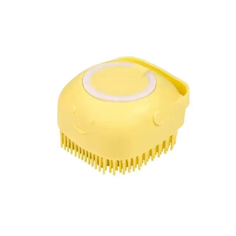 Dog bath brush in yellow color with a smiling face design for effective grooming and bathing.