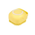 Dog bath brush in yellow color with a smiling face design for effective grooming and bathing.